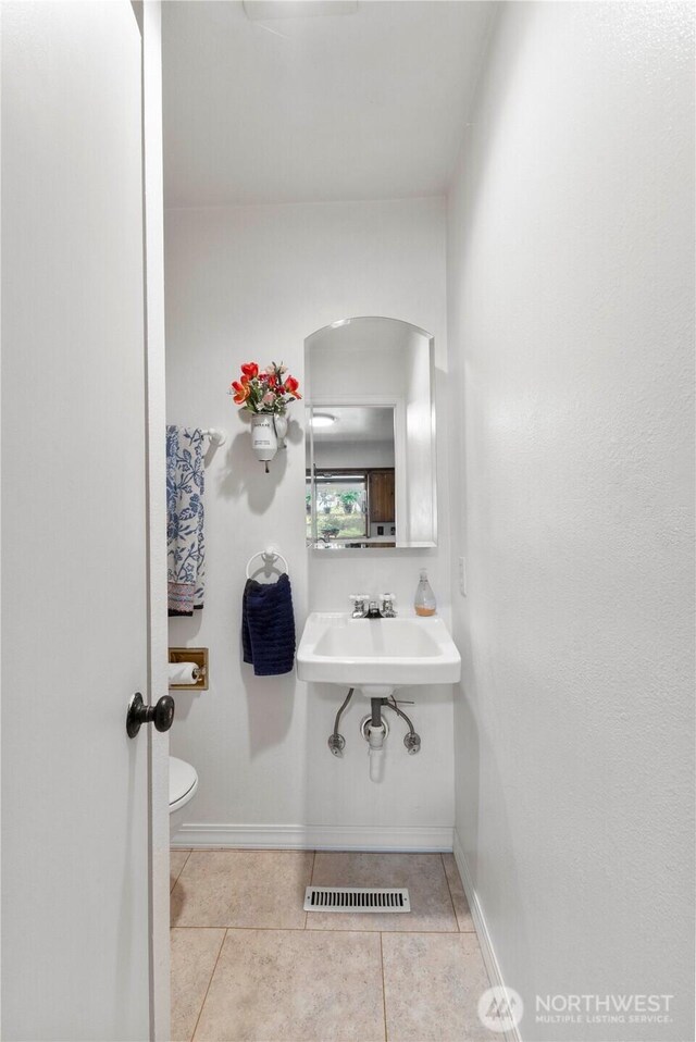 8415 57th Ave E, Puyallup, WA 98371 - half bath with tile patterned flooring and toilet