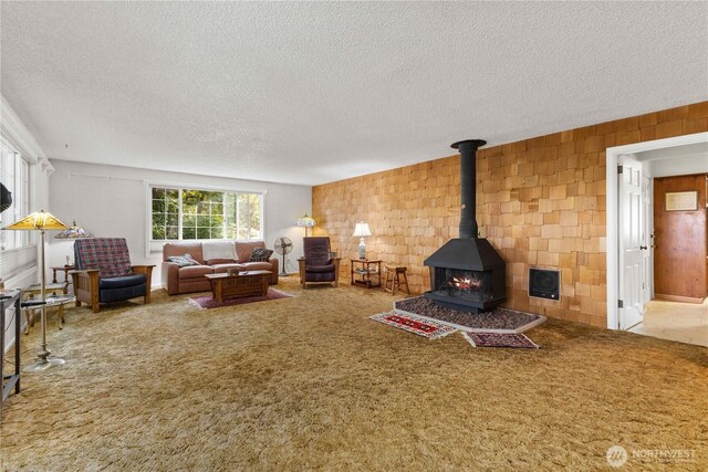 8415 57th Ave E, Puyallup, WA 98371 - carpeted living room with a textured ceiling and a wood stove