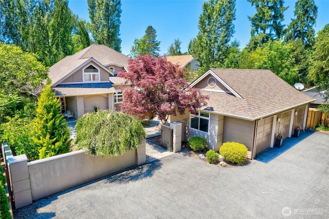 13730 Main St, Bellevue, WA 98005 - view of front of home with a shingled roof, an attached garage, and asphalt driveway
