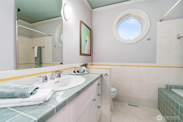 13730 Main St, Bellevue, WA 98005 - full bath featuring tiled shower, vanity, tile walls, tile patterned flooring, and a relaxing tiled tub
