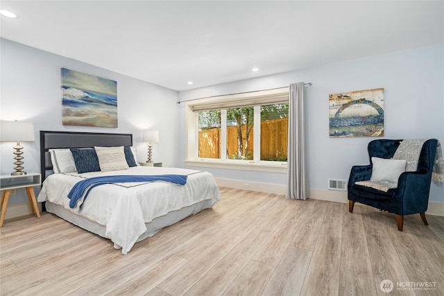13730 Main St, Bellevue, WA 98005 - bedroom with light wood finished floors and recessed lighting
