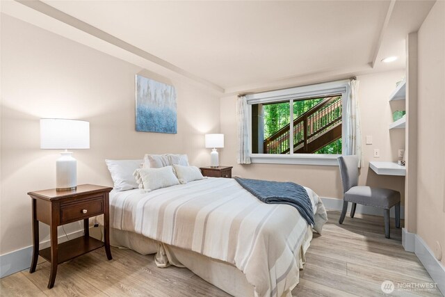 13730 Main St, Bellevue, WA 98005 - bedroom featuring light wood finished floors and baseboards