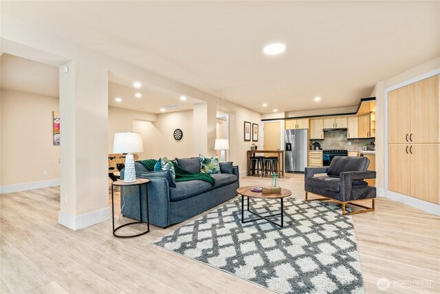 13730 Main St, Bellevue, WA 98005 - living room featuring light wood-style floors and recessed lighting