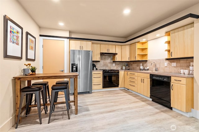 13730 Main St, Bellevue, WA 98005 - kitchen featuring black appliances, light brown cabinetry, open shelves, under cabinet range hood, and recessed lighting