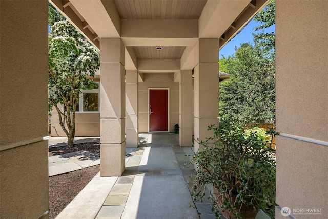 13730 Main St, Bellevue, WA 98005 - doorway to property with stucco siding and a patio area