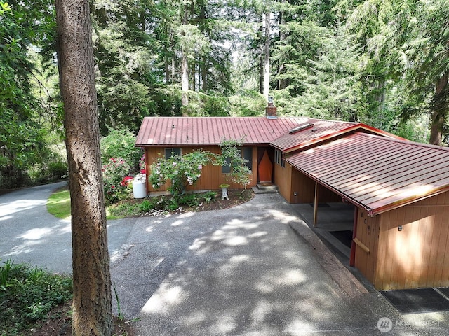 808 Woodsong Ln, Langley, WA 98260 - view of front of house featuring a metal roof and a view of trees