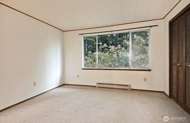 808 Woodsong Ln, Langley, WA 98260 - unfurnished bedroom featuring a baseboard radiator, carpet floors, crown molding, and a closet