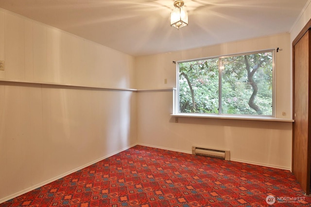 808 Woodsong Ln, Langley, WA 98260 - spare room featuring a baseboard heating unit and carpet floors