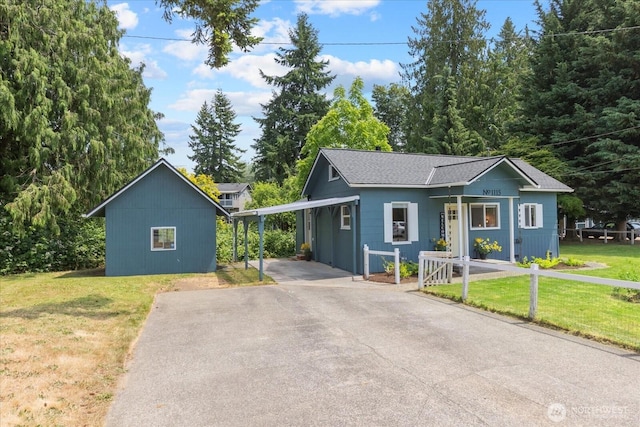 1115Avenue A, Snohomish, WA 98290 - view of front of home featuring a front lawn, driveway, and a shingled roof
