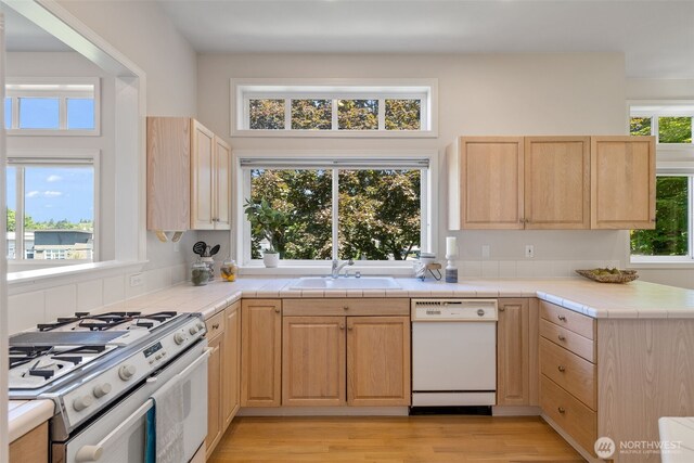 327 2nd Ave S, Kirkland, WA 98033 - kitchen with white appliances, light brown cabinets, tile countertops, and light wood finished floors