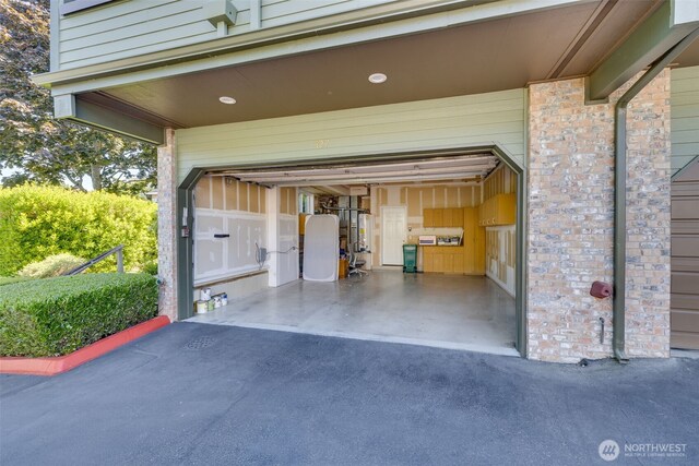 327 2nd Ave S, Kirkland, WA 98033 - garage with driveway and gas water heater