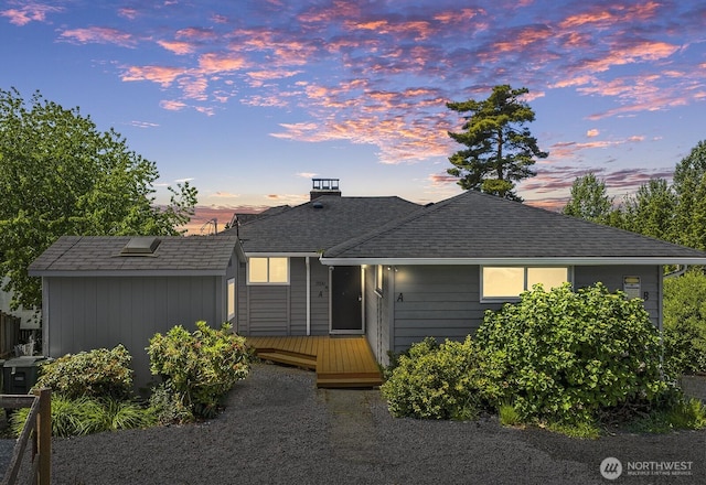 15330 40th Ave W Unit A & B, Lynnwood, WA 98087 - view of front of house with a deck, a chimney, and roof with shingles