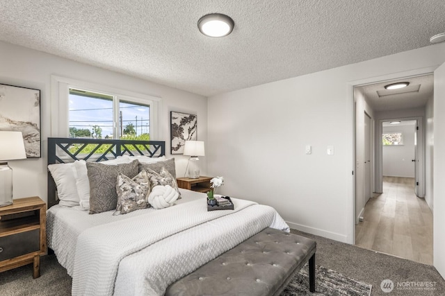 15330 40th Ave W Unit A & B, Lynnwood, WA 98087 - bedroom featuring multiple windows, a textured ceiling, carpet flooring, and baseboards