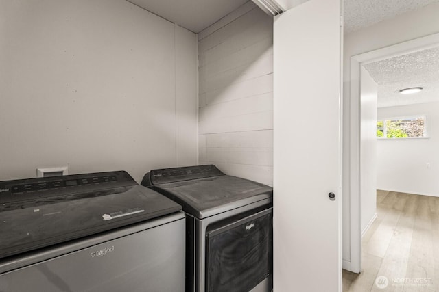 15330 40th Ave W Unit A & B, Lynnwood, WA 98087 - washroom with washer and dryer, a textured ceiling, and light wood finished floors