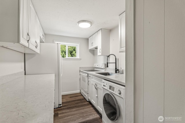 15330 40th Ave W Unit A & B, Lynnwood, WA 98087 - washroom featuring washer / dryer, dark wood-style floors, a textured ceiling, and baseboards