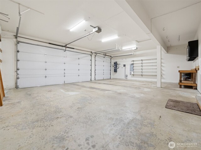 29247 188th Ave SE, Kent, WA 98042 - garage with a garage door opener and a central vacuum unit