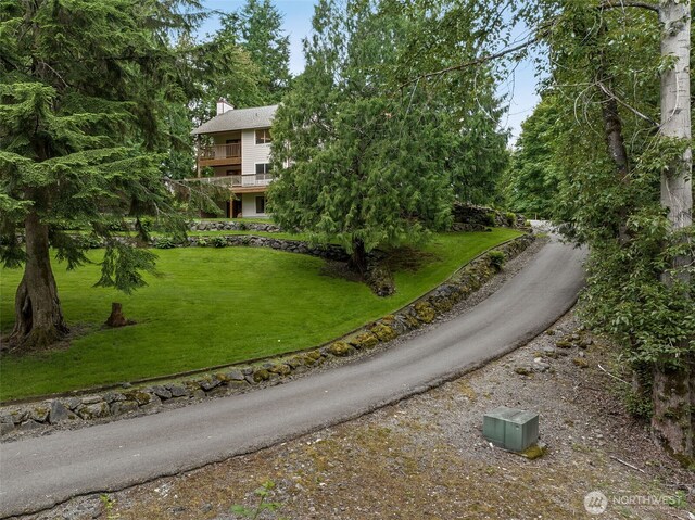 29247 188th Ave SE, Kent, WA 98042 - view of front of property featuring a chimney, a front yard, and a balcony