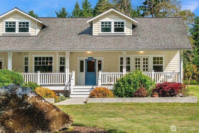 19840 Vashon Hwy SW, Vashon, WA 98070 - view of front of home with a porch, roof with shingles, and a front yard