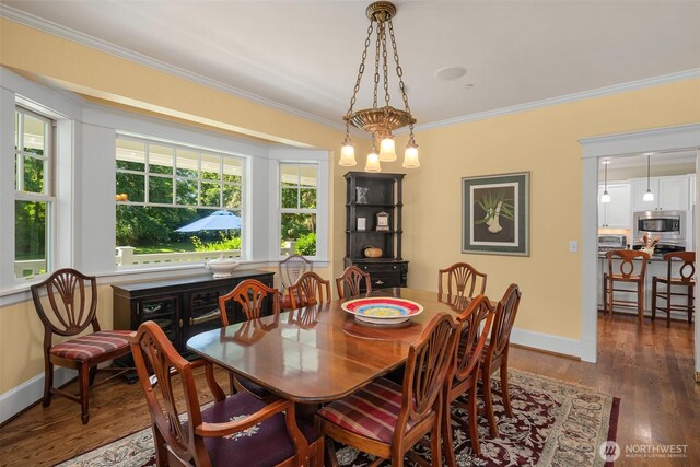 19840 Vashon Hwy SW, Vashon, WA 98070 - dining room featuring crown molding and wood finished floors