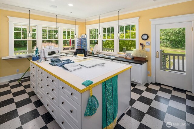 19840 Vashon Hwy SW, Vashon, WA 98070 - kitchen with dark floors, white cabinetry, healthy amount of natural light, a center island, and recessed lighting