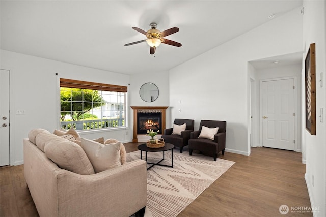 312 W 2nd St # 3, Nooksack, WA 98276 - living area with a ceiling fan, vaulted ceiling, a glass covered fireplace, and wood finished floors