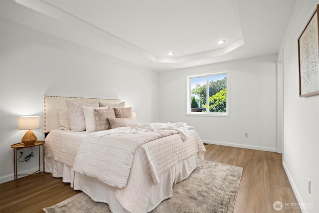 312 W 2nd St # 3, Nooksack, WA 98276 - bedroom with wood finished floors, a tray ceiling, and recessed lighting