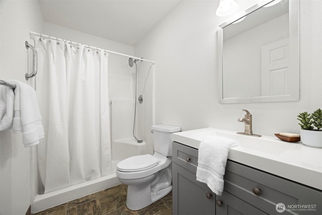 312 W 2nd St # 3, Nooksack, WA 98276 - bathroom featuring vanity, a shower with shower curtain, and stone finish flooring