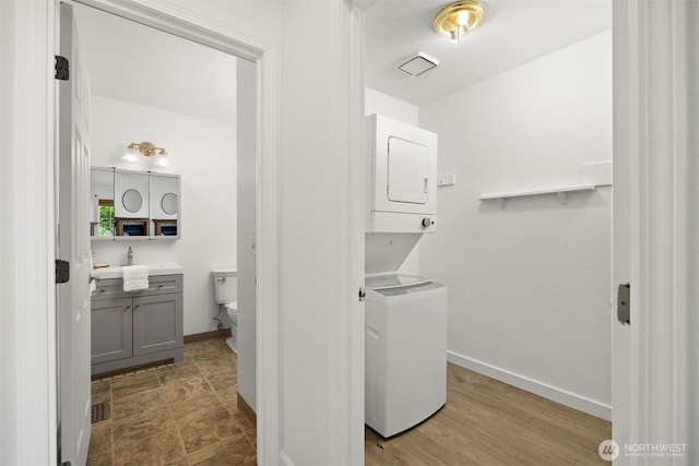 312 W 2nd St # 3, Nooksack, WA 98276 - bathroom with stacked washing machine and dryer and vanity