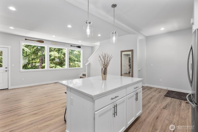 18207 Majestic Ridge Ln, Mount Vernon, WA 98274 - kitchen featuring freestanding refrigerator, plenty of natural light, recessed lighting, white cabinetry, and light wood-style floors