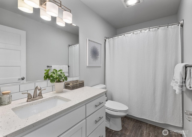 18207 Majestic Ridge Ln, Mount Vernon, WA 98274 - bathroom with vanity, wood finished floors, a shower with curtain, and backsplash