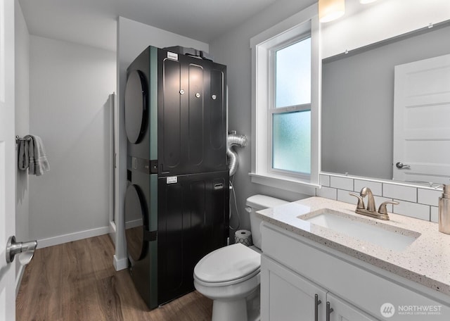 18207 Majestic Ridge Ln, Mount Vernon, WA 98274 - bathroom featuring estacked washer and dryer, wood finished floors, and vanity