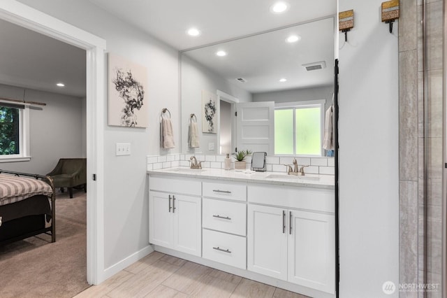 18207 Majestic Ridge Ln, Mount Vernon, WA 98274 - ensuite bathroom featuring double vanity, recessed lighting, and backsplash