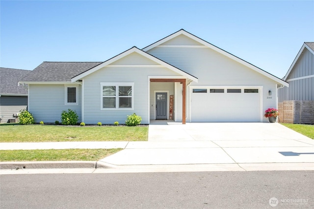 2183 Lagerwey Cir, Lynden, WA 98264 - view of front of property with driveway, an attached garage, and roof with shingles