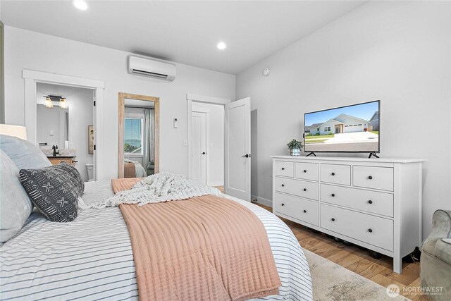 2183 Lagerwey Cir, Lynden, WA 98264 - bedroom featuring an AC wall unit, wood finished floors, and recessed lighting
