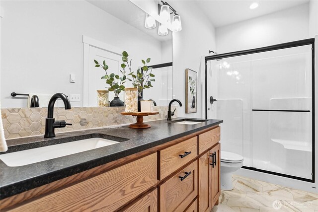 2183 Lagerwey Cir, Lynden, WA 98264 - full bath featuring double vanity, a stall shower, marble look tile flooring, and tasteful backsplash