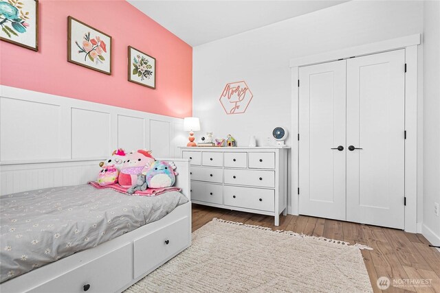 2183 Lagerwey Cir, Lynden, WA 98264 - bedroom featuring wood finished floors, a decorative wall, and wainscoting