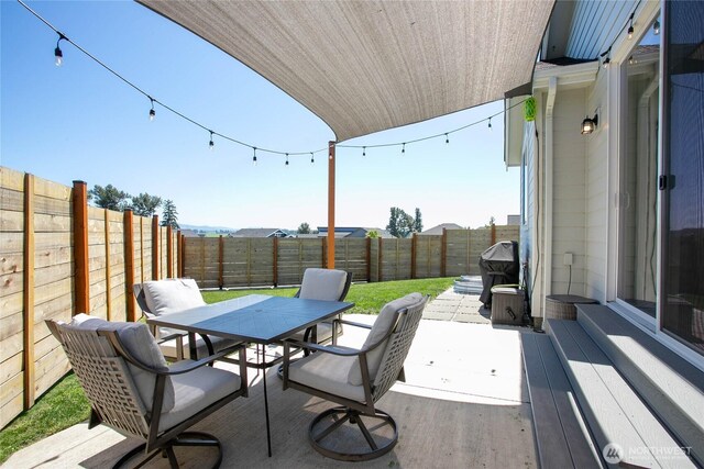 2183 Lagerwey Cir, Lynden, WA 98264 - fenced backyard with outdoor dining space and a patio area