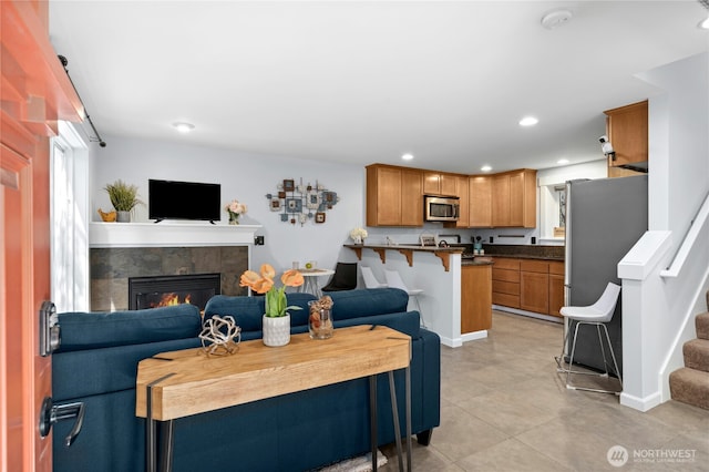 1506 12th Ave S Unit B, Seattle, WA 98144 - living room featuring a fireplace, recessed lighting, stairs, and light tile patterned flooring