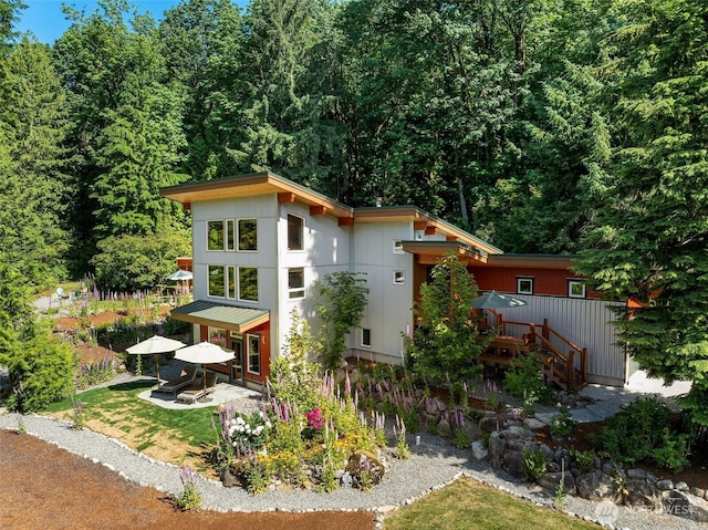 20720 501st Dr SE, Index, WA 98251 - rear view of house featuring a deck and a wooded view