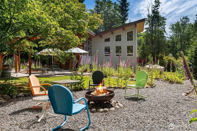 20720 501st Dr SE, Index, WA 98251 - view of yard with a fire pit and a patio area