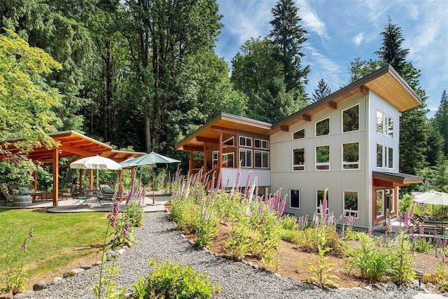 20720 501st Dr SE, Index, WA 98251 - back of house featuring a patio area and a lawn