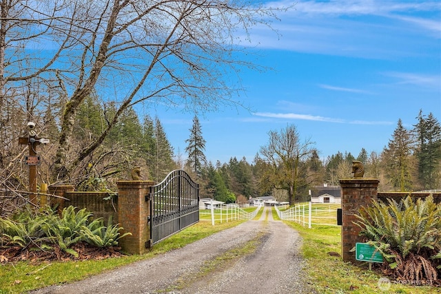 1204 SE Oak Rd, Port Orchard, WA 98367 - view of dirt / gravel driveway with a gate and a gated entry