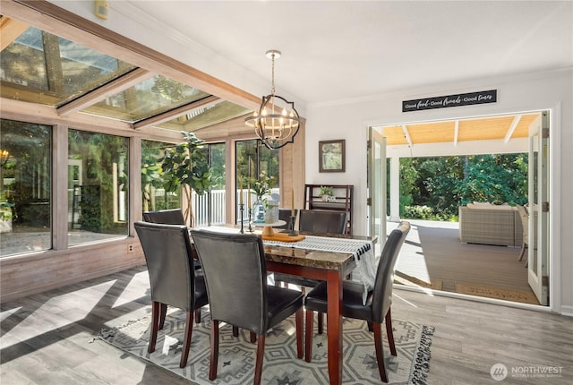 1204 SE Oak Rd, Port Orchard, WA 98367 - dining room featuring a chandelier, wood finished floors, and crown molding