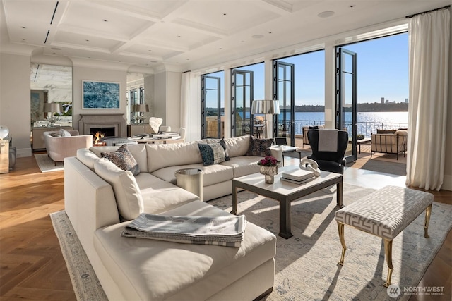 1615 Roanoke Way, Mercer Island, WA 98040 - living area featuring a water view, coffered ceiling, plenty of natural light, a lit fireplace, and beamed ceiling