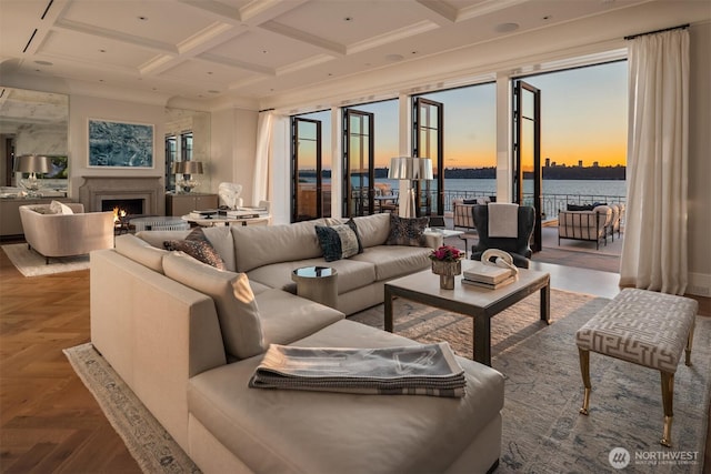 1615 Roanoke Way, Mercer Island, WA 98040 - living area with a water view, coffered ceiling, a warm lit fireplace, and beam ceiling