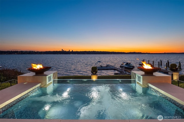 1615 Roanoke Way, Mercer Island, WA 98040 - pool at dusk with an outdoor fire pit, a water view, and a jacuzzi