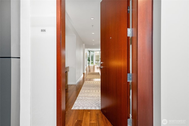 10700 NE 4th St Unit 806, Bellevue, WA 98004 - hall featuring wood finished floors and baseboards