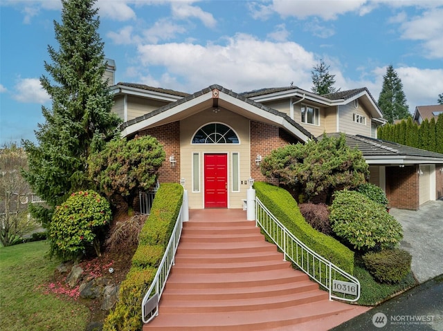 10316 NE 153rd Pl, Bothell, WA 98011 - view of front facade featuring a chimney and brick siding