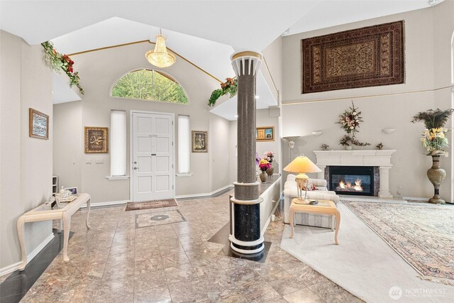 10316 NE 153rd Pl, Bothell, WA 98011 - foyer with baseboards, a glass covered fireplace, and high vaulted ceiling