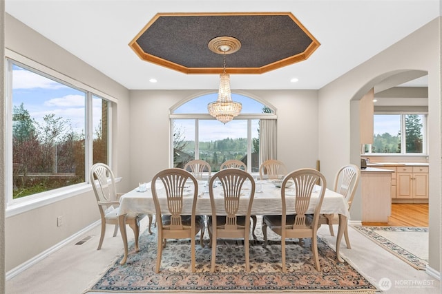 10316 NE 153rd Pl, Bothell, WA 98011 - dining room with a raised ceiling, a chandelier, and healthy amount of natural light